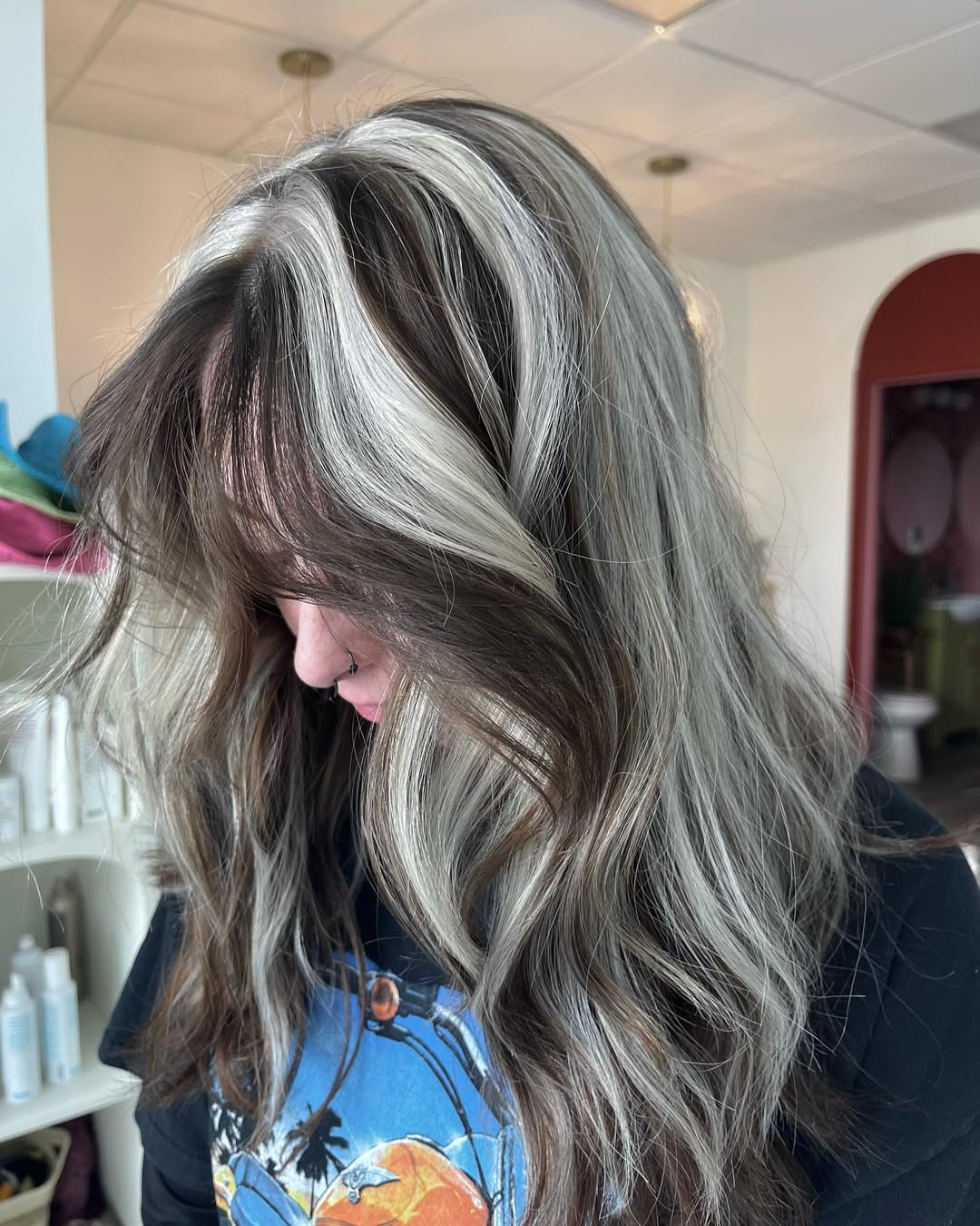 Dramatic Skunk Stripe Face Framing Wavy Hair