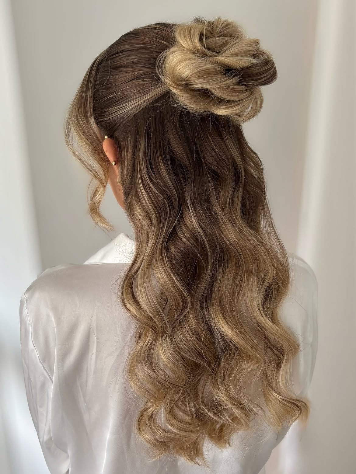 Elegant Half-Up Twisted Bun With Loose Waves