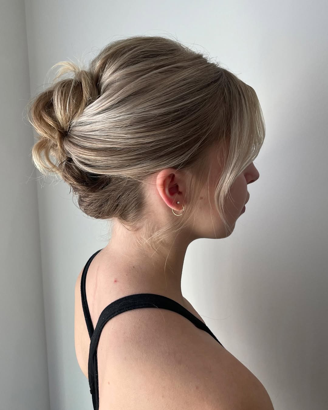 Elegant Low Bun Updo With Wispy Face-Framing Layers