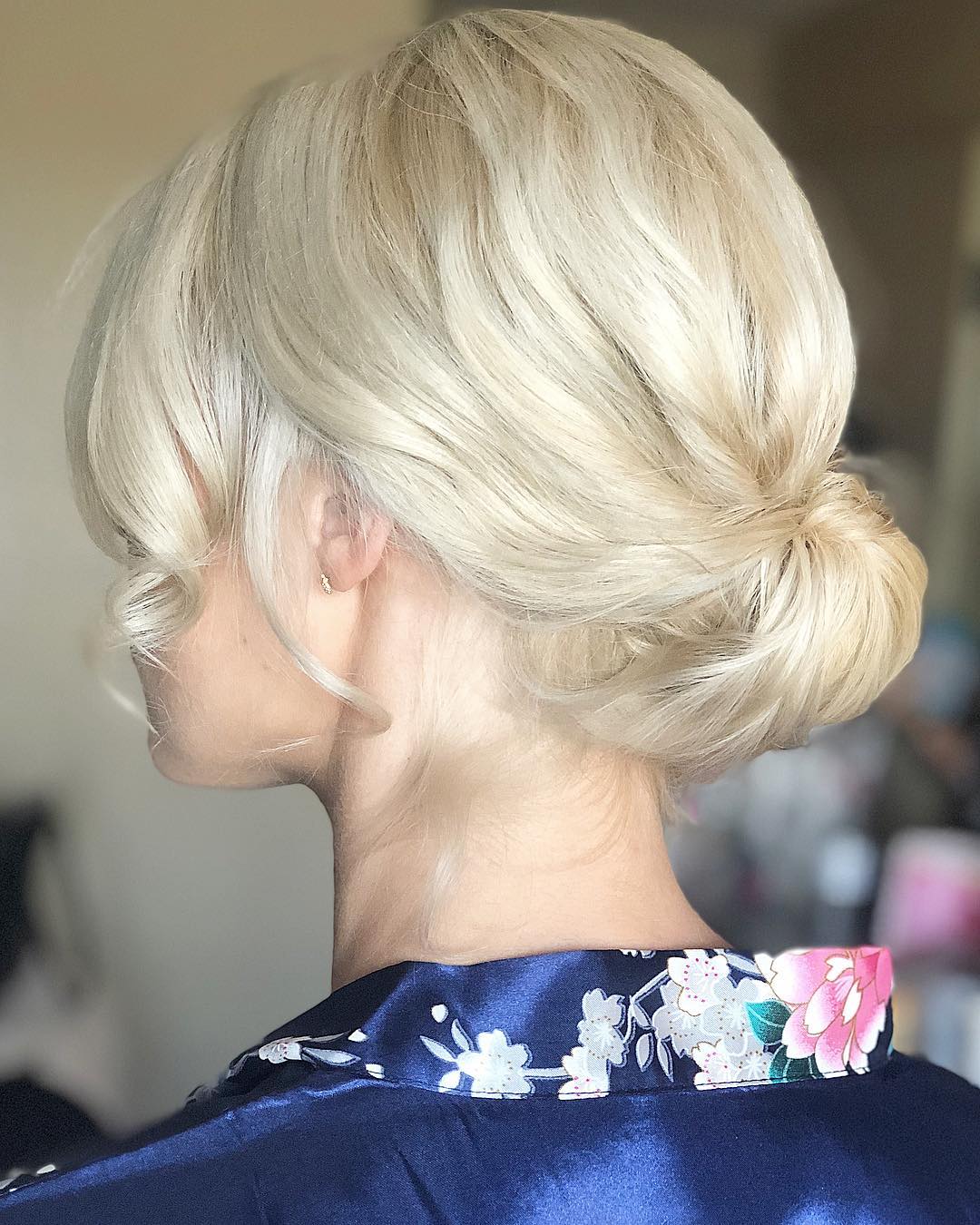 Elegant Platinum Blonde Low Bun Updo