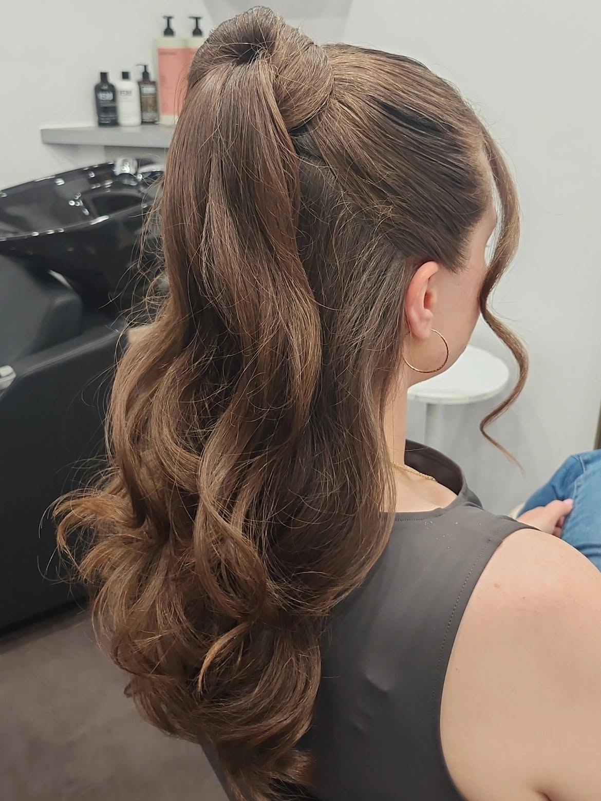 Elegant Twisted High Ponytail With Loose Curls
