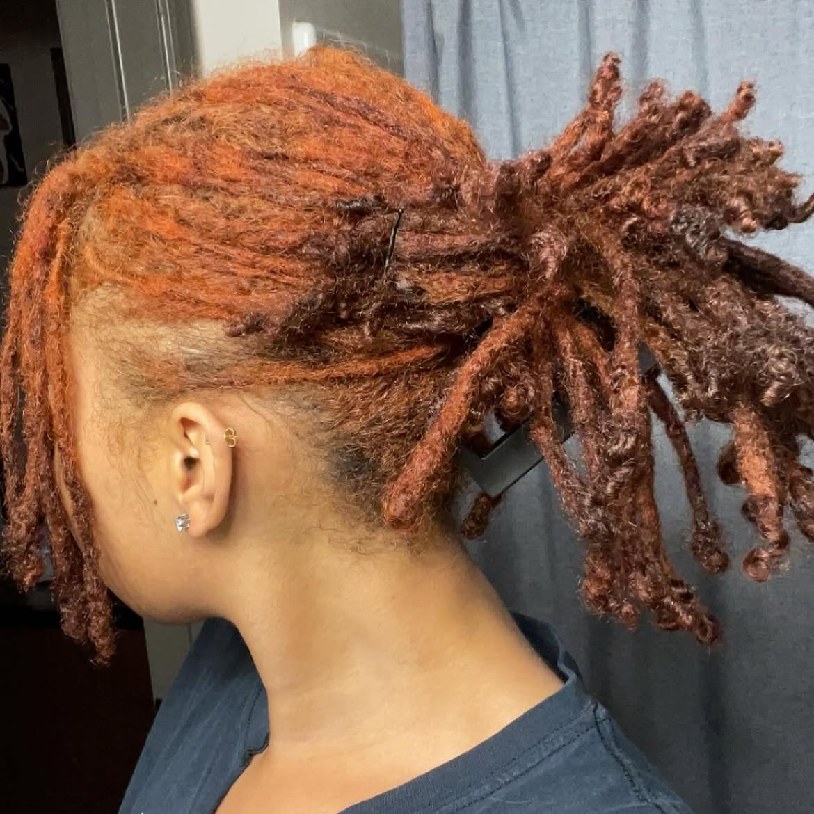 Fiery Auburn Loc Bun With Exposed Undercut