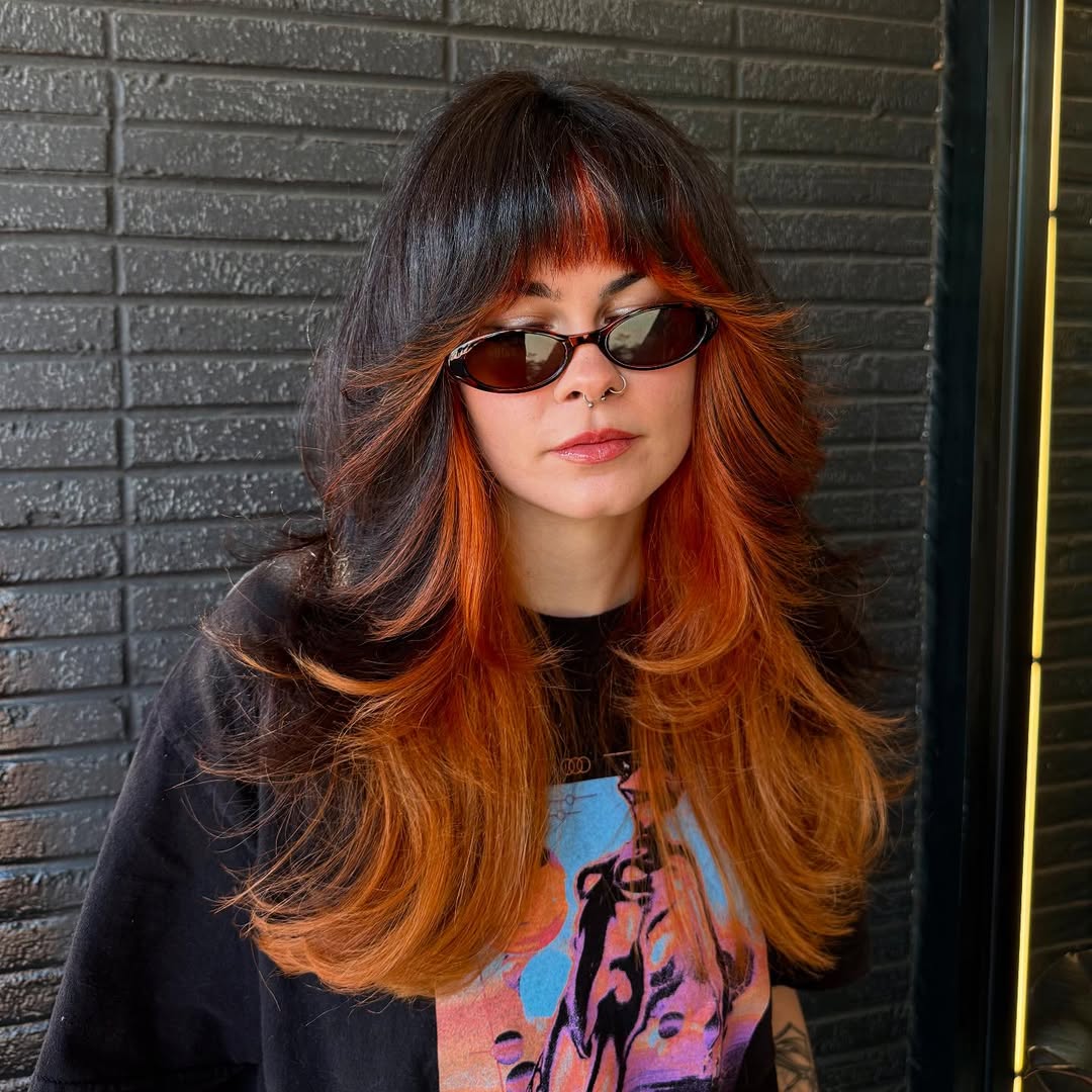 Fiery Phoenix Long Shag Haircut with Full Fringe