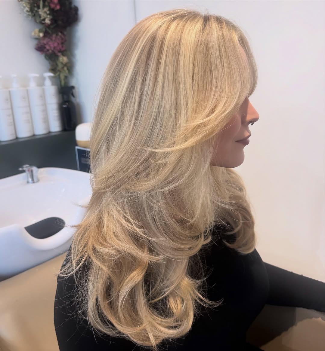 Full Volume Honey Blonde Layers With Curtain Bangs