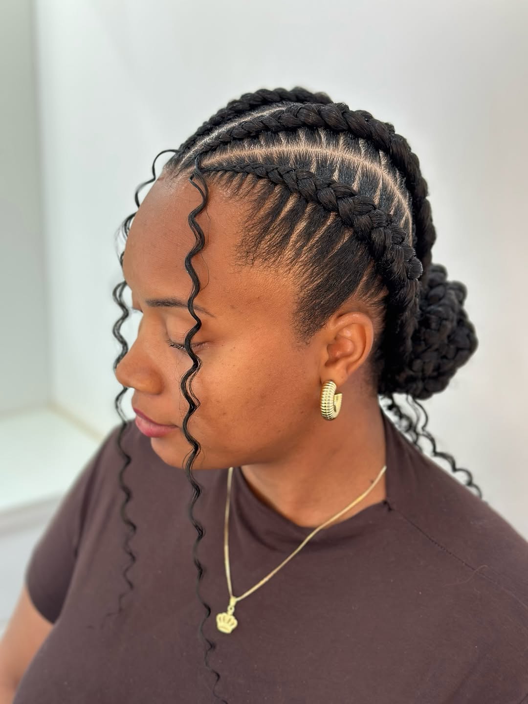 Ghana Braids Updo With Wavy Tendrils