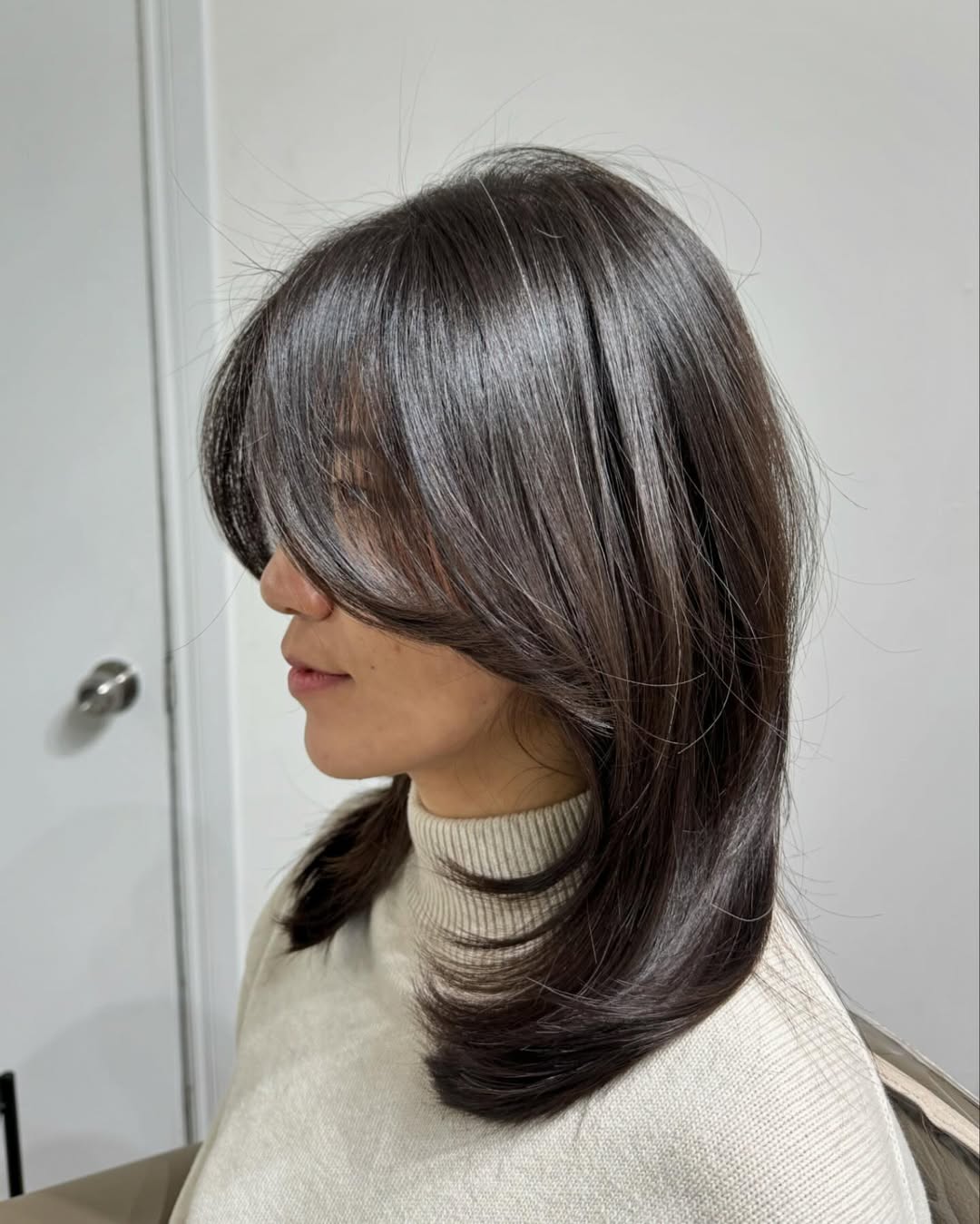 Glossy Dark Brown Shoulder-Length Layers With Curtain Bangs