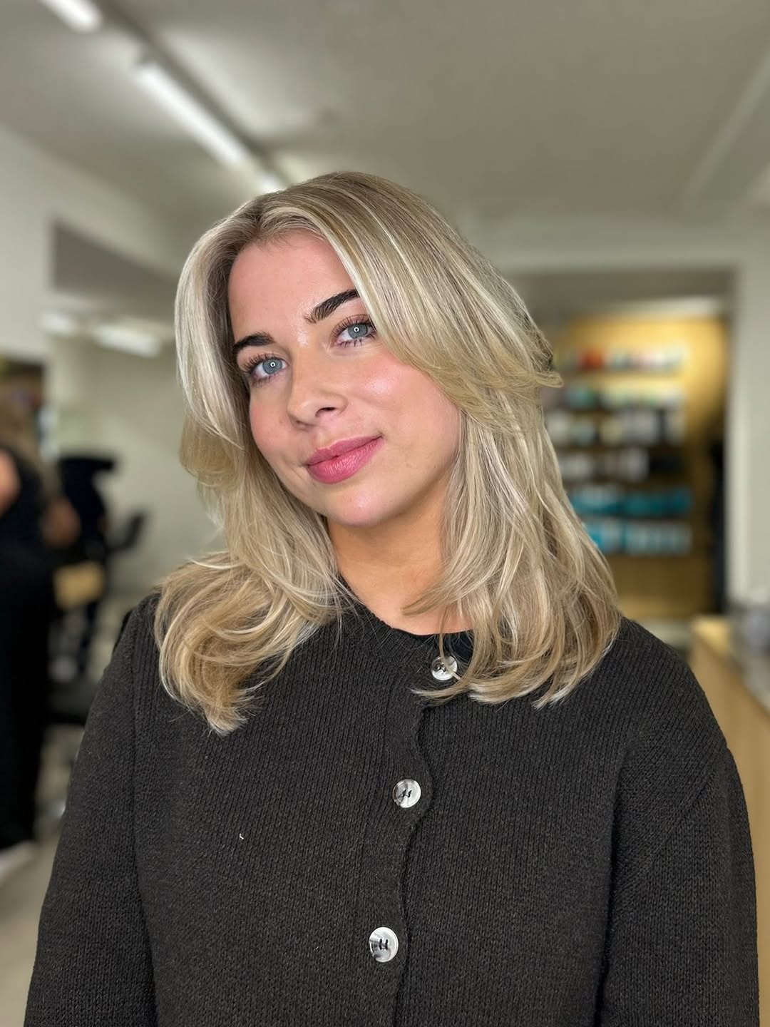 Golden Blonde Layers With Face Framing Bangs