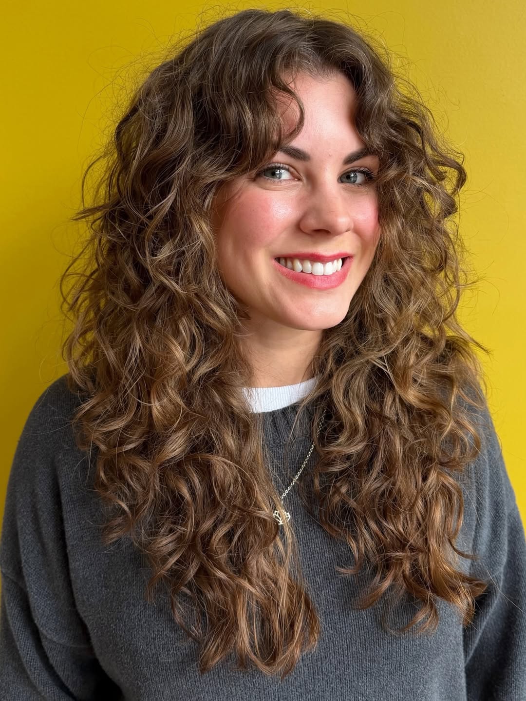 Gorgeous Layered Curly Cut With Subtle Highlights