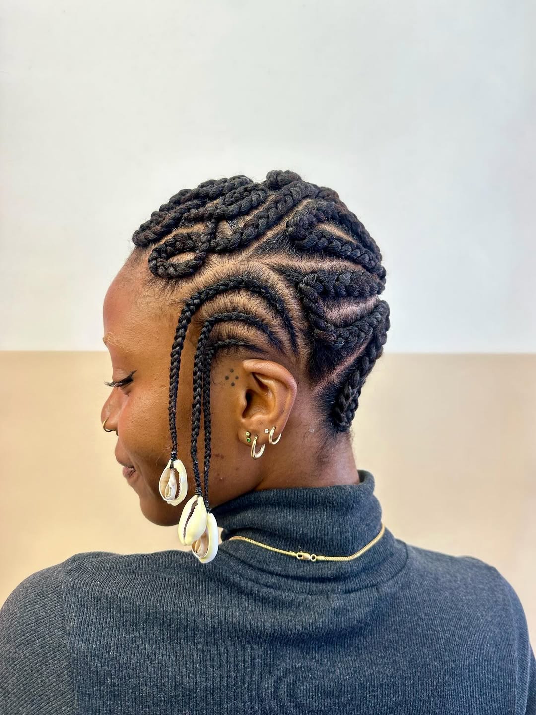 Intricate Feed-in Braids with Cowrie Shell Accents