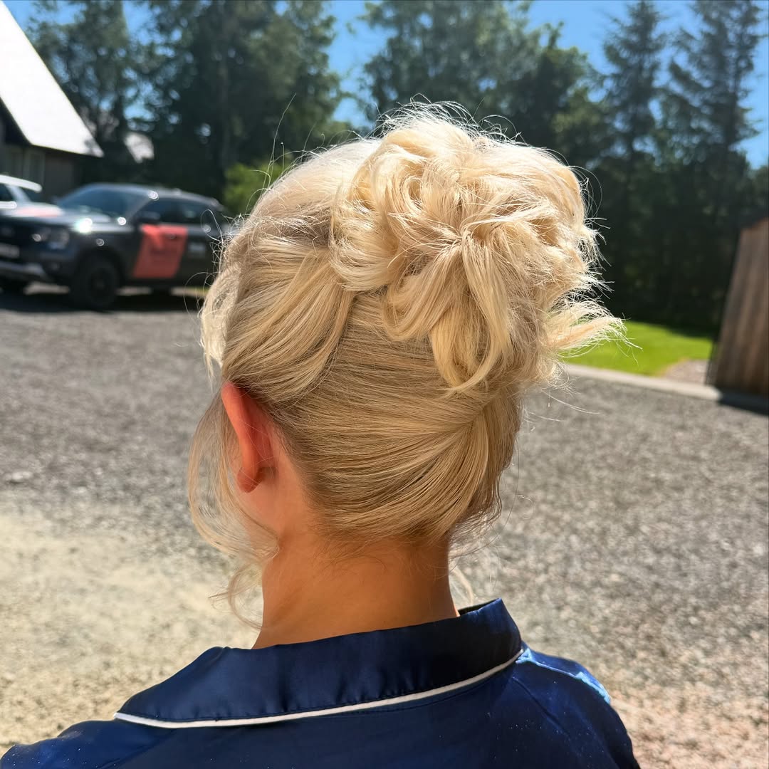 Messy Updo With Face Framing Tendrils