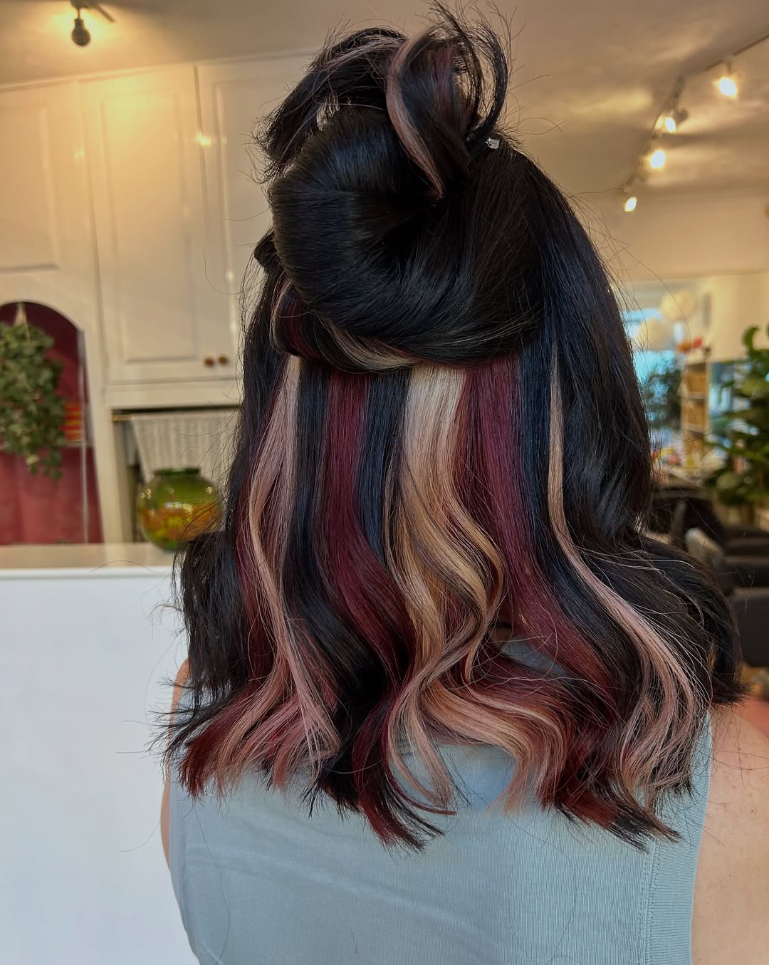 Multi-Tone Peekaboo In Wavy Shoulder-Length Hair