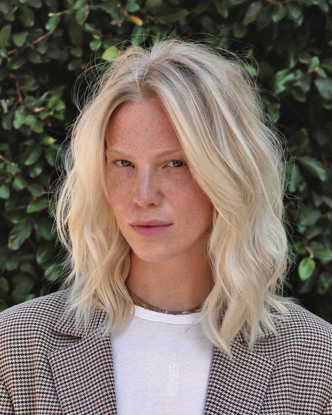 Platinum Blonde Lob With Rooted Dimension And Wavy Texture