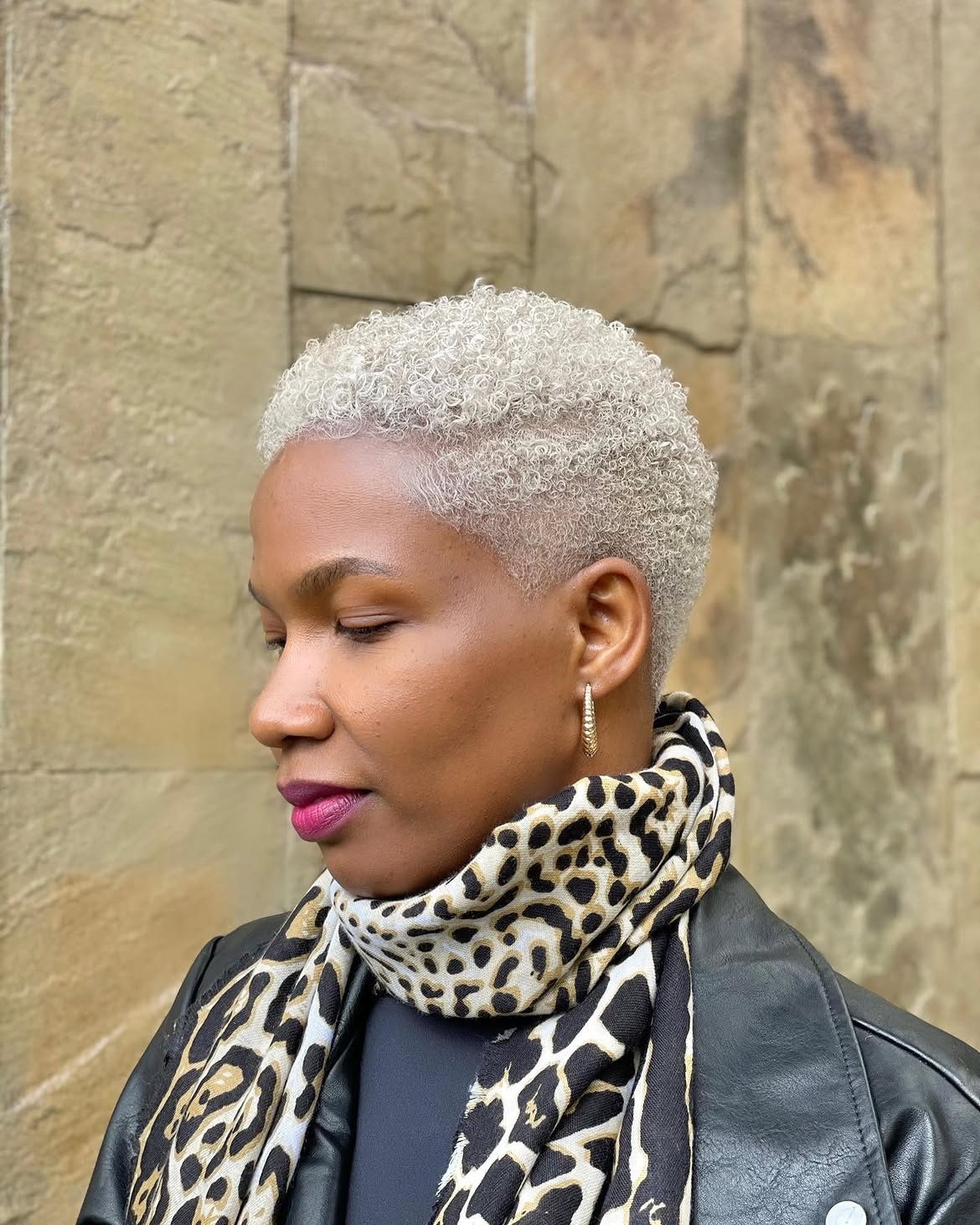 Platinum Blonde Tapered Cut With Defined Curls