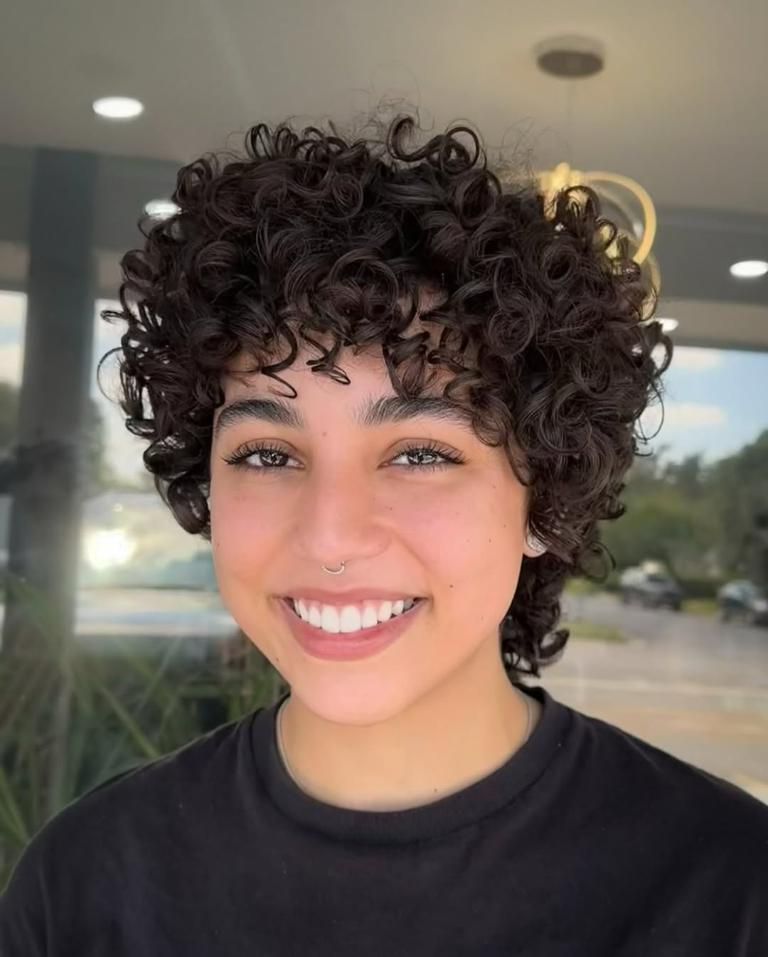Playful Curly Crop With Wispy Bangs