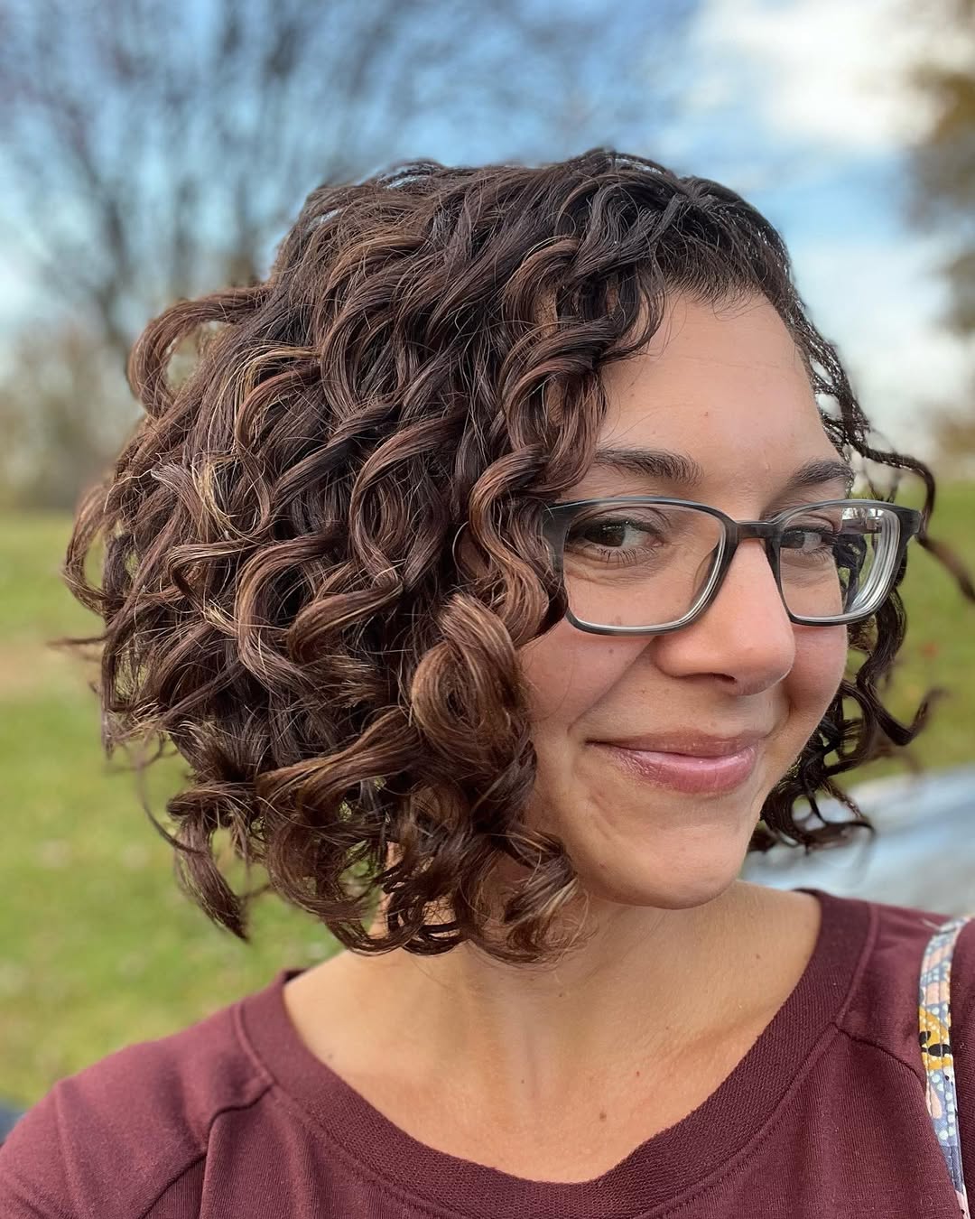 Playful Face-Framing Short Curly Bob