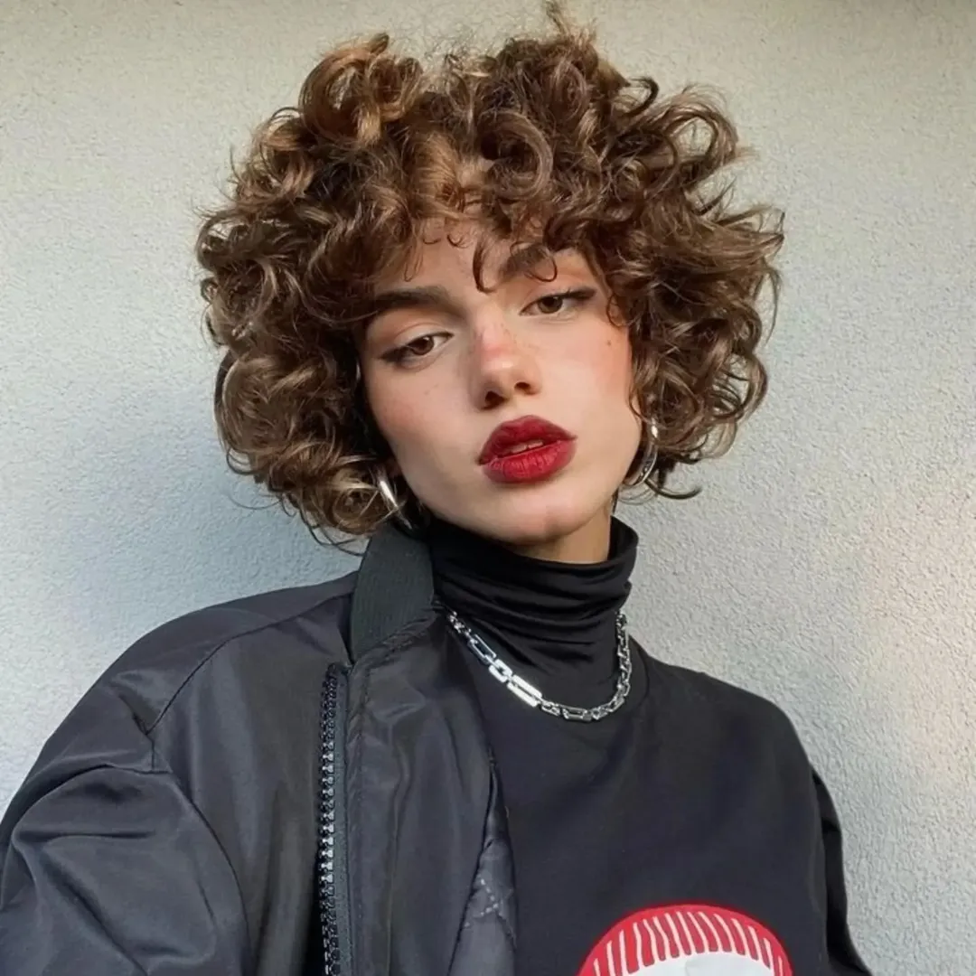 Playful Pixie Cut With Defined Auburn Curls