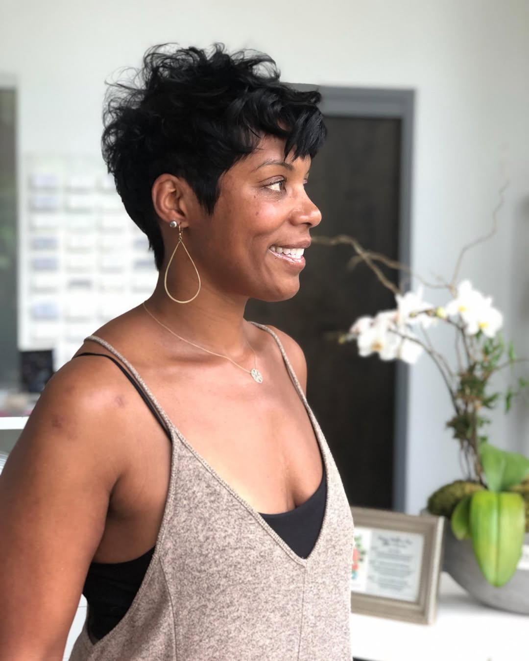 Playful Pixie Cut With Defined Jet Black Curls