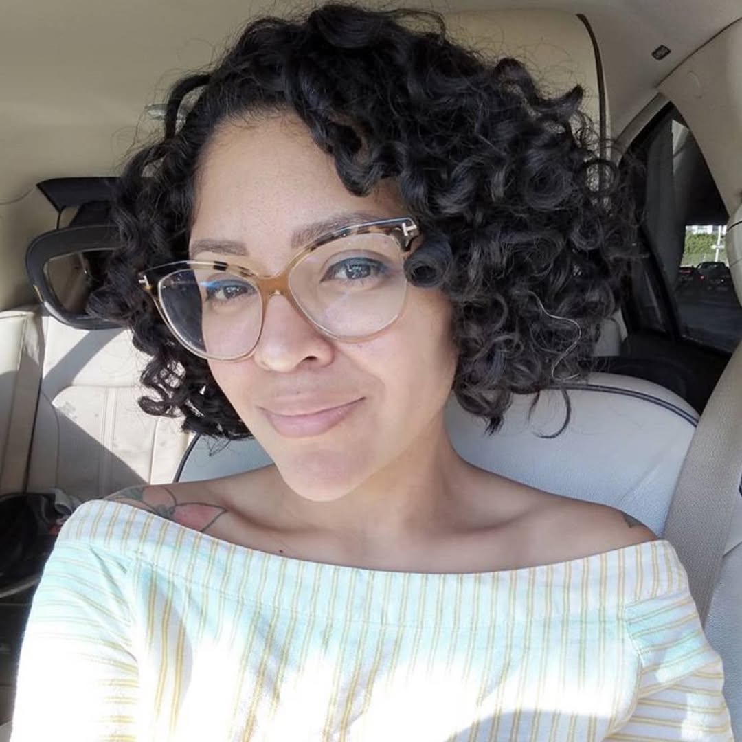 Playful Shoulder-Length Coils With Side Part