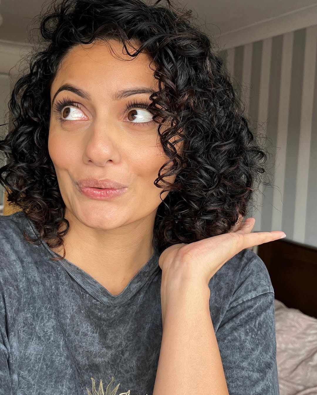 Playful Shoulder-Length Curly Cut With Volume