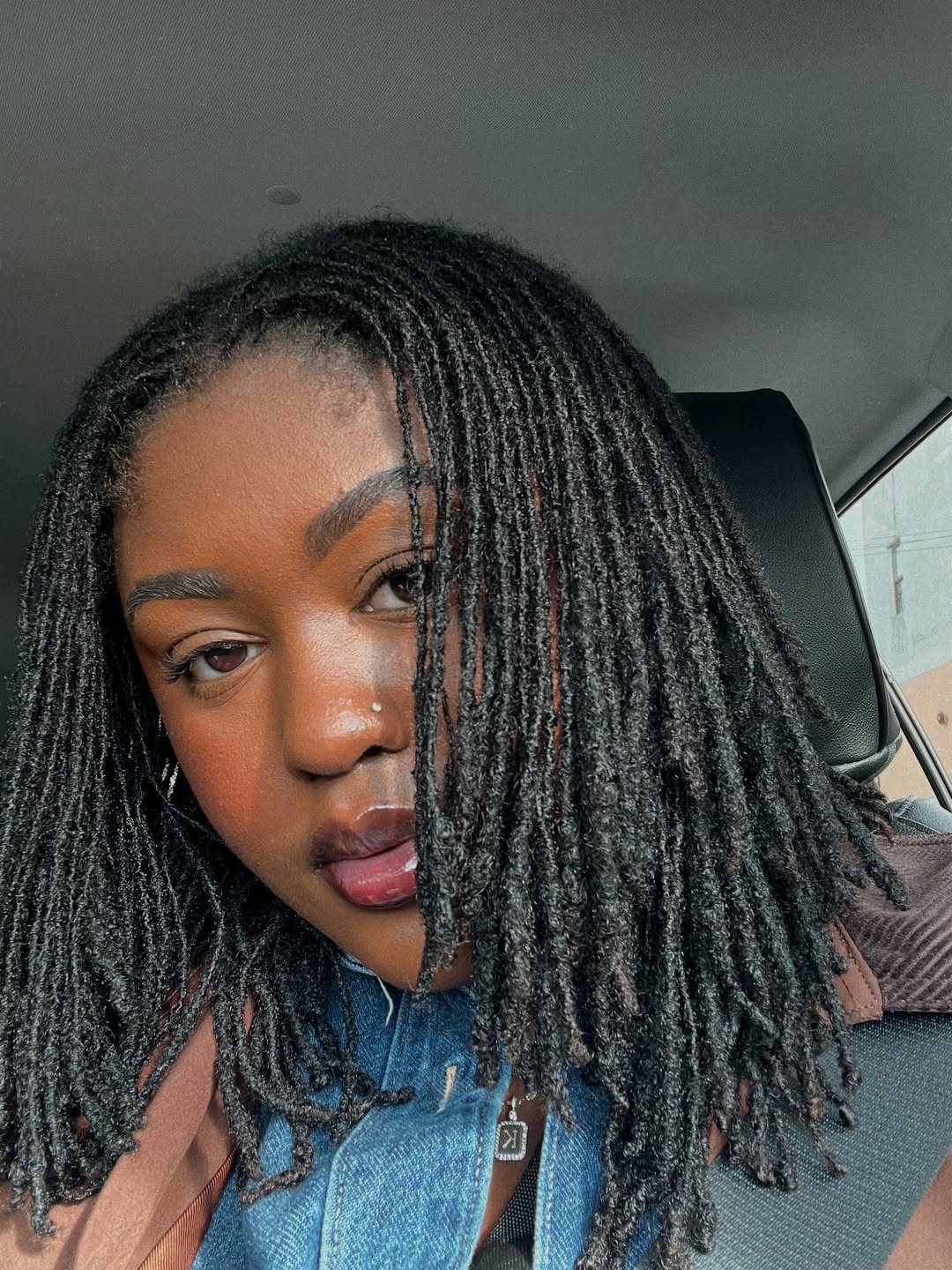 Relaxed Shoulder-Length Locs With Side Part
