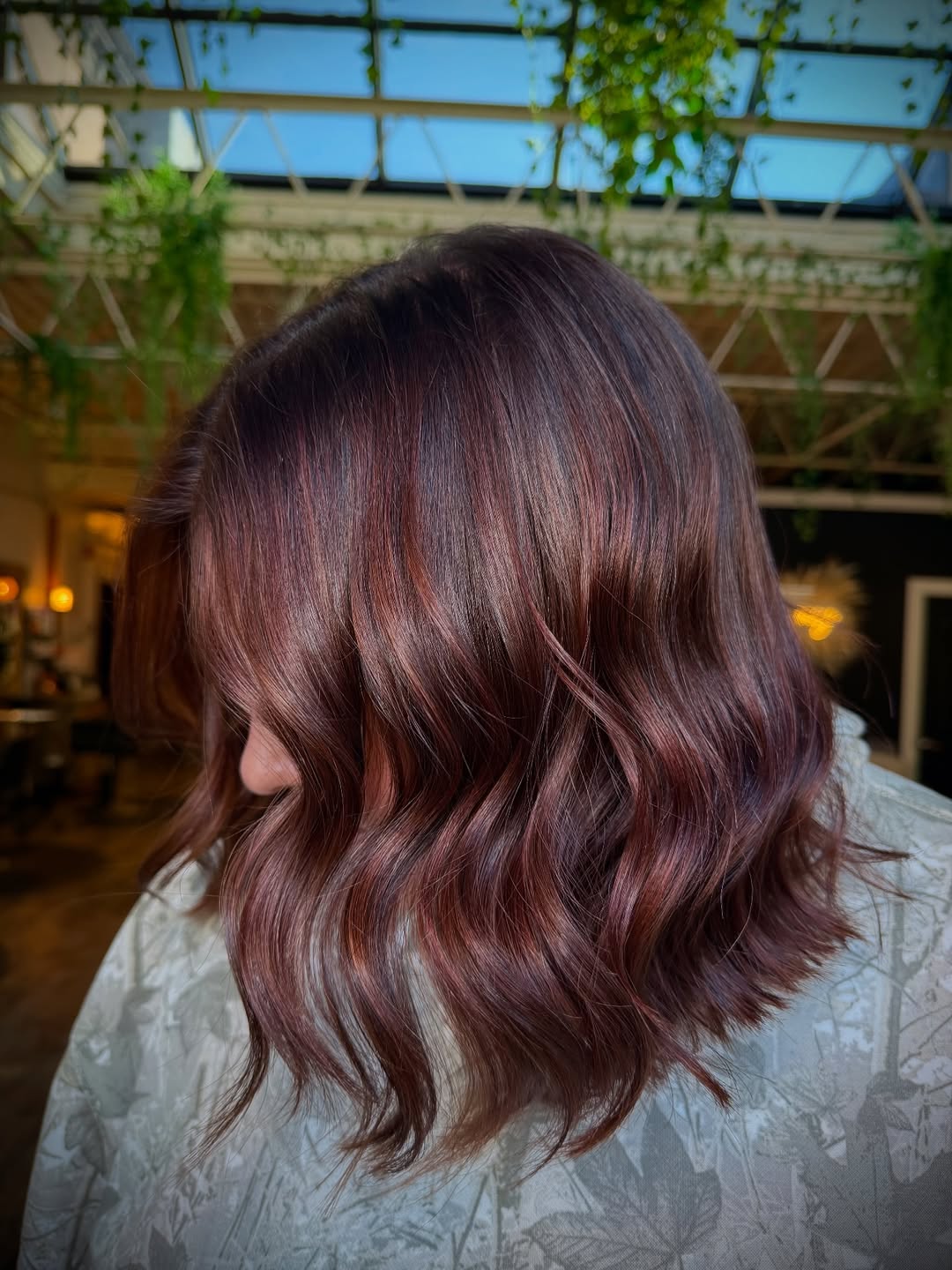 Rich Rosewood Waves On Shoulder-Length Hair