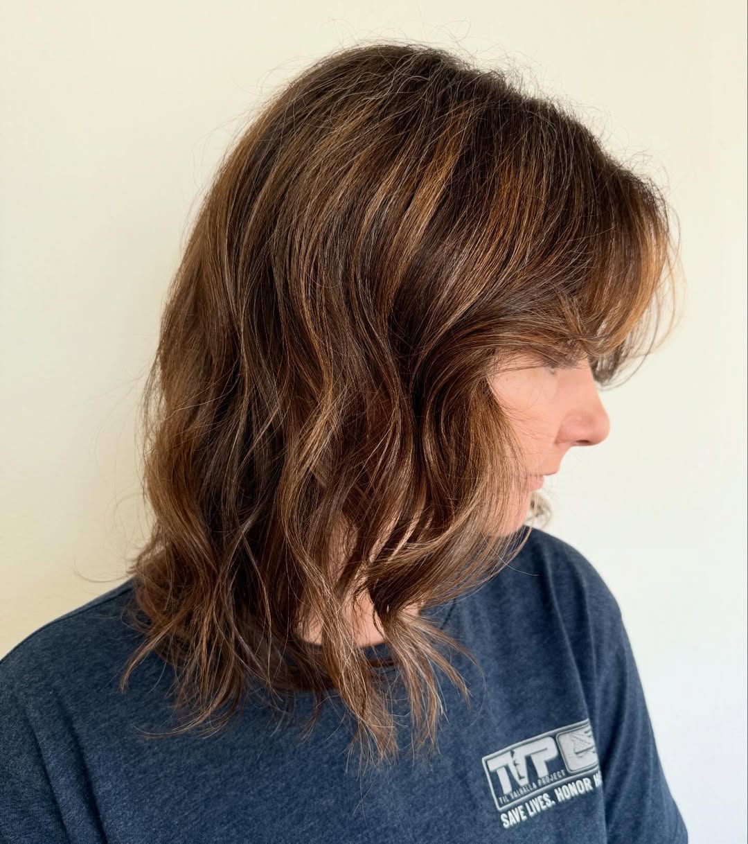 Shaggy Brunette Lob With Caramel Highlights and Bangs
