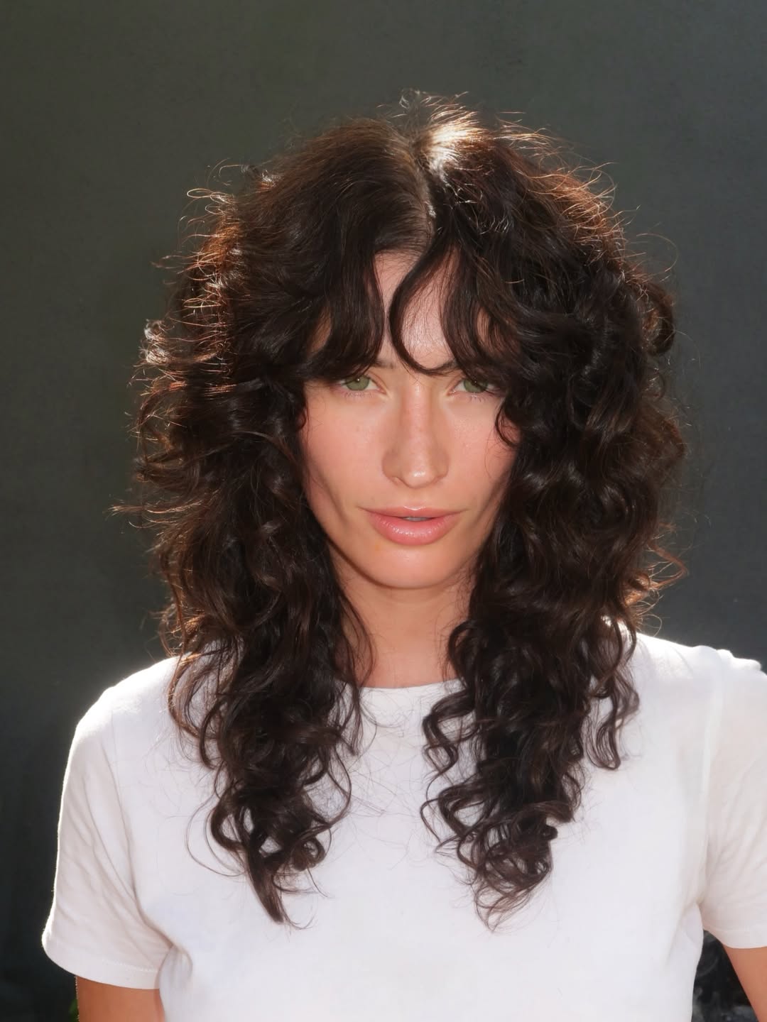 Shaggy Layers On Deep Brunette Curls
