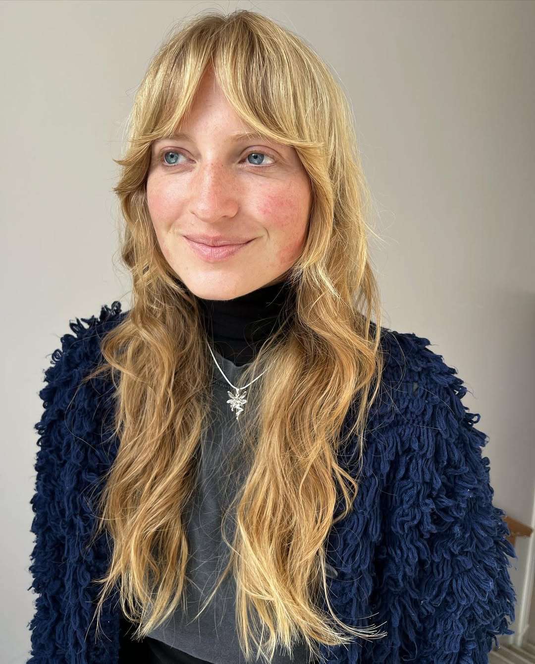Shaggy Layers With Golden Blonde Curtain Bangs