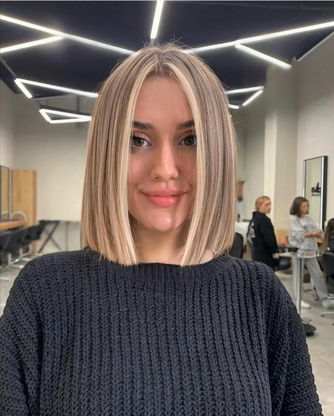 Sleek Blonde Money Piece Chin-Length Blunt Bob