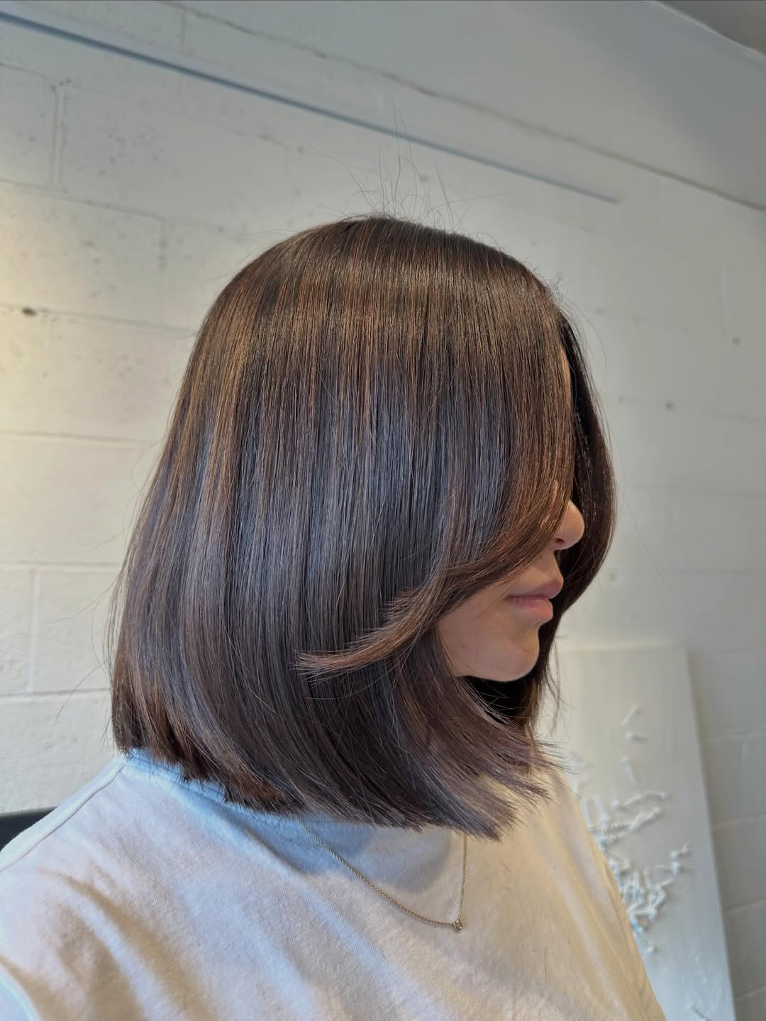 Sleek Chocolate Brown Lob With Face-Framing Layers