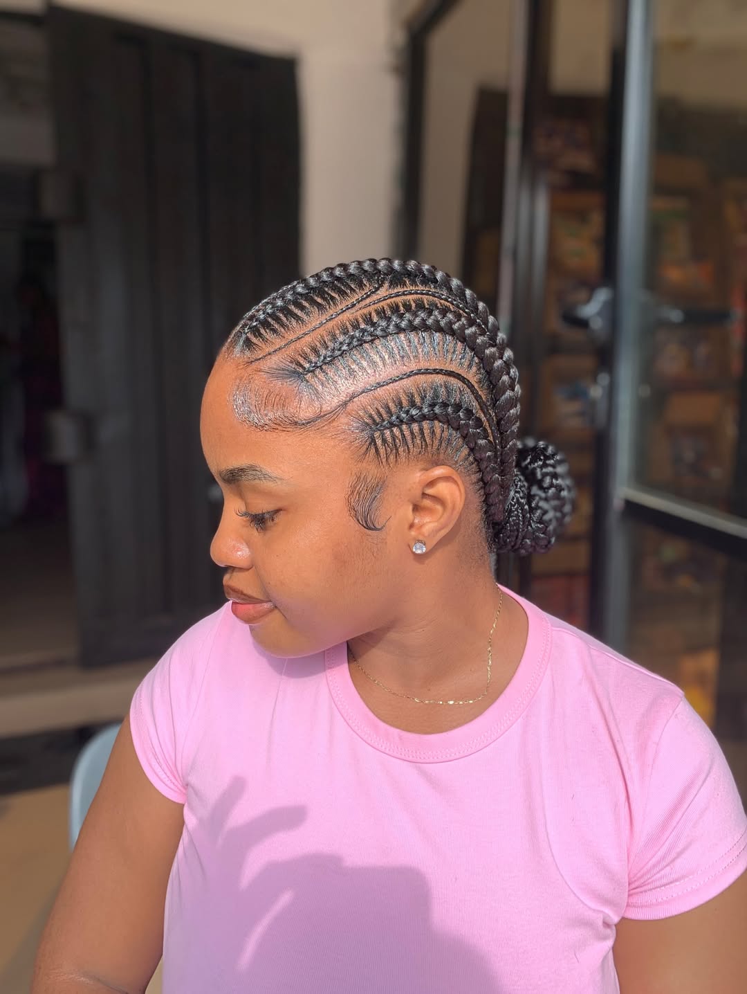Sleek Cornrow Braids Into Low Bun