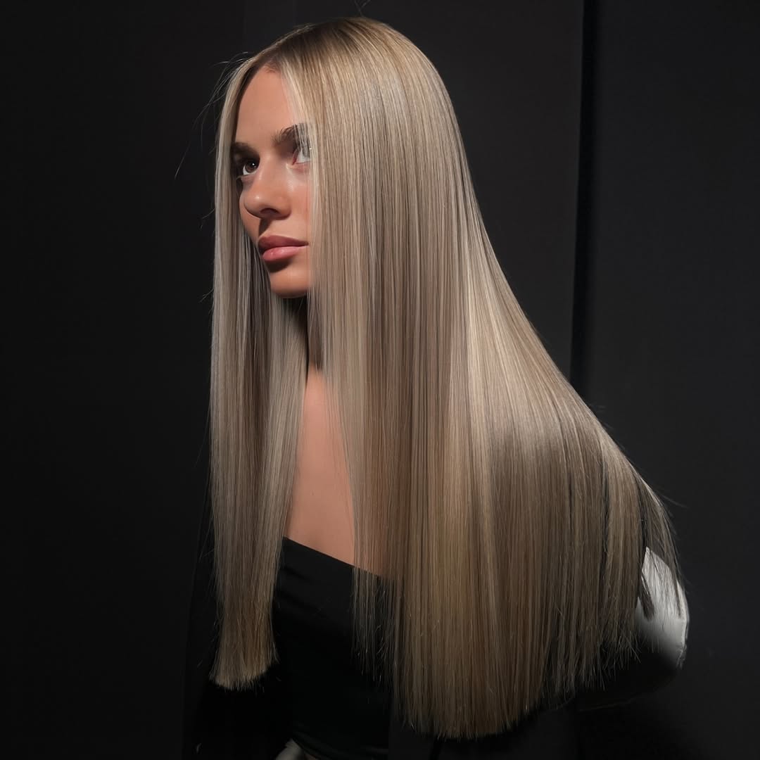 Sleek Platinum Blonde Balayage With Face-Framing Layers