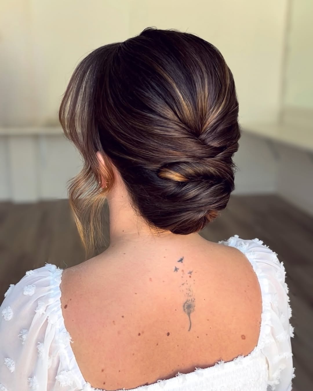 Sophisticated Chignon Updo With Brunette Highlights