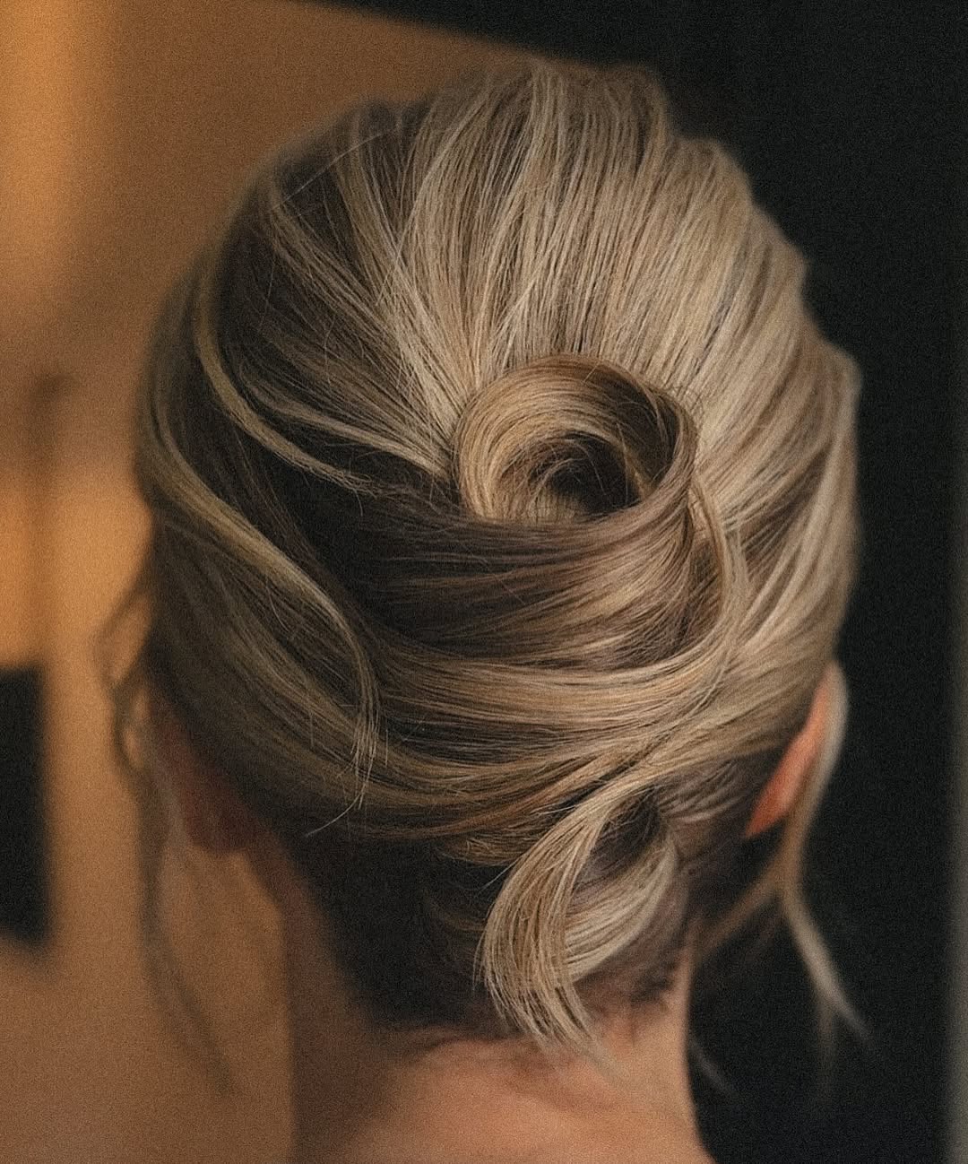 Sophisticated Low Bun With Elegant Swirl Accent