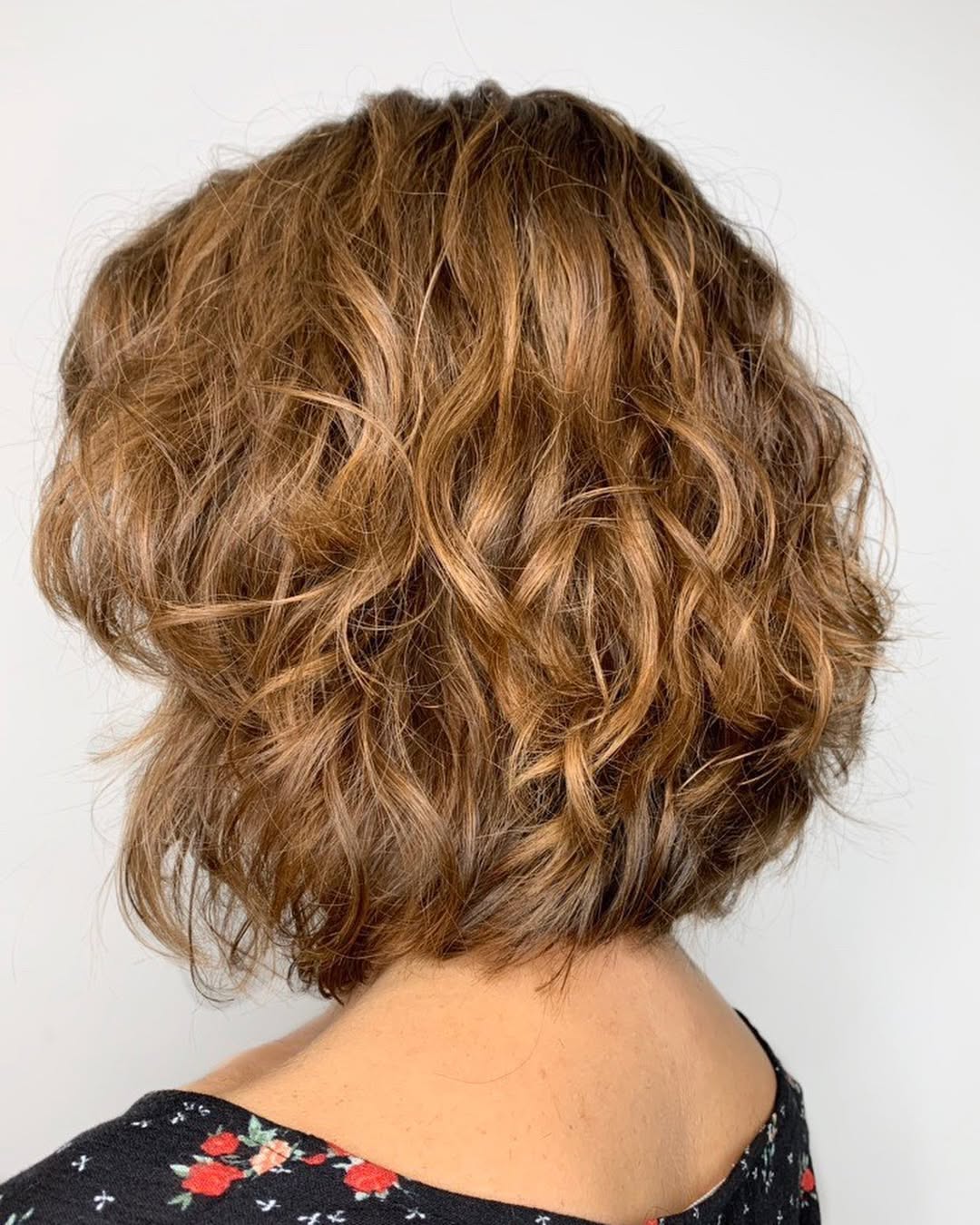 Textured Auburn Bob With Golden Curly Highlights