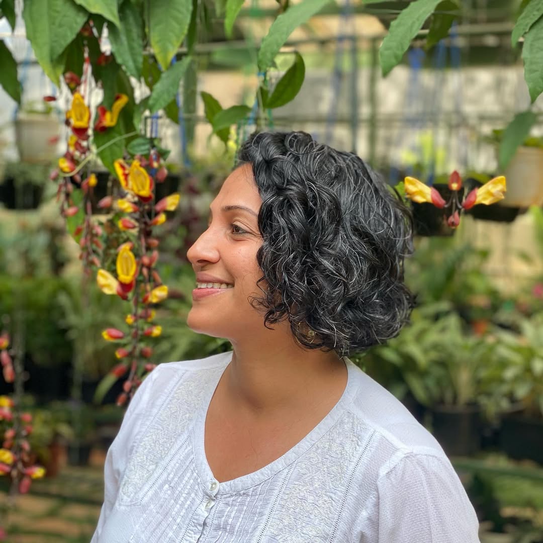 Textured Chin-Length Curly Bob With Natural Silver Strands