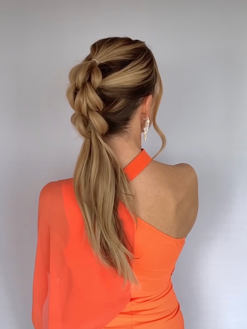 Textured Dutch Braid Ponytail With Loose Waves