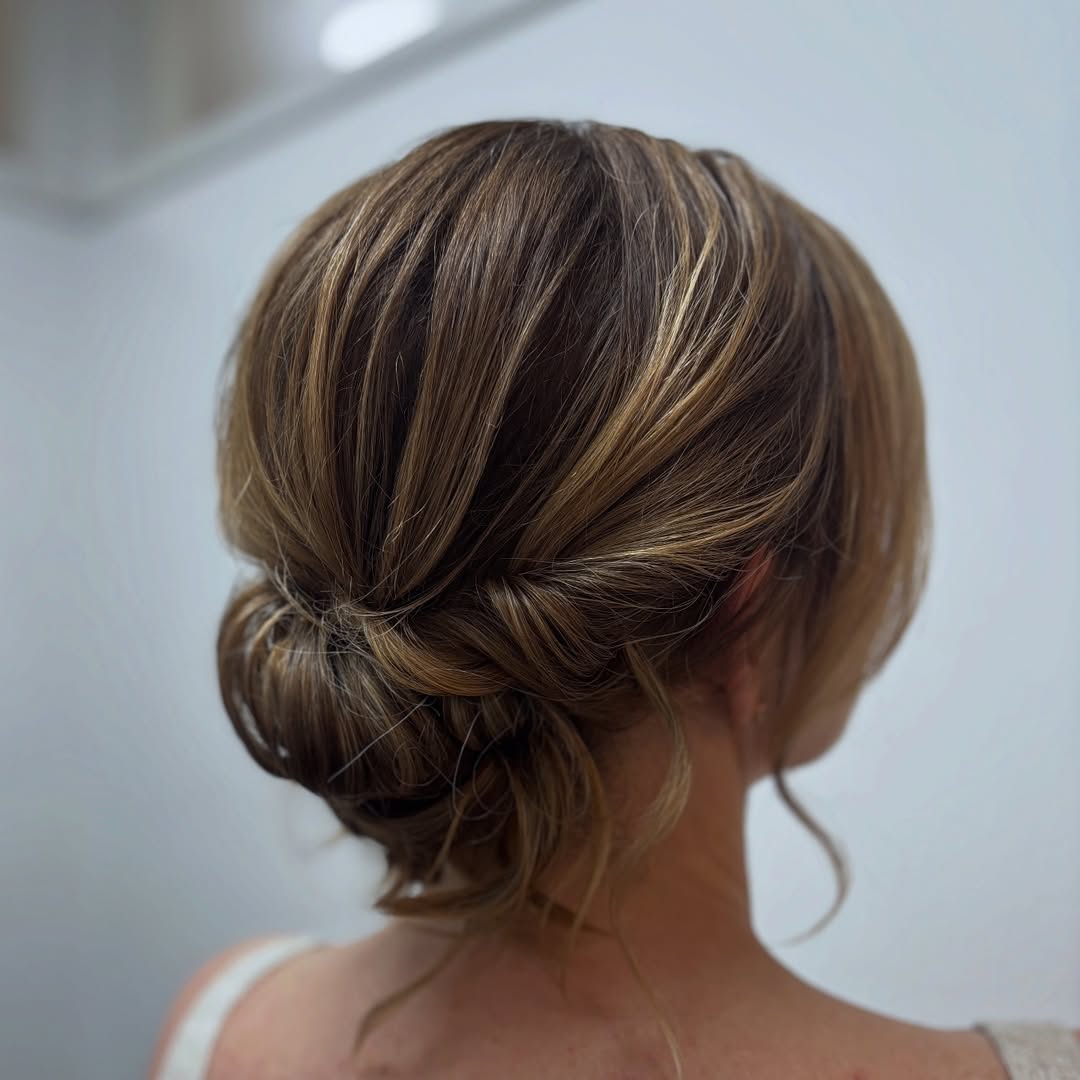 Textured Low Bun With Caramel Highlights