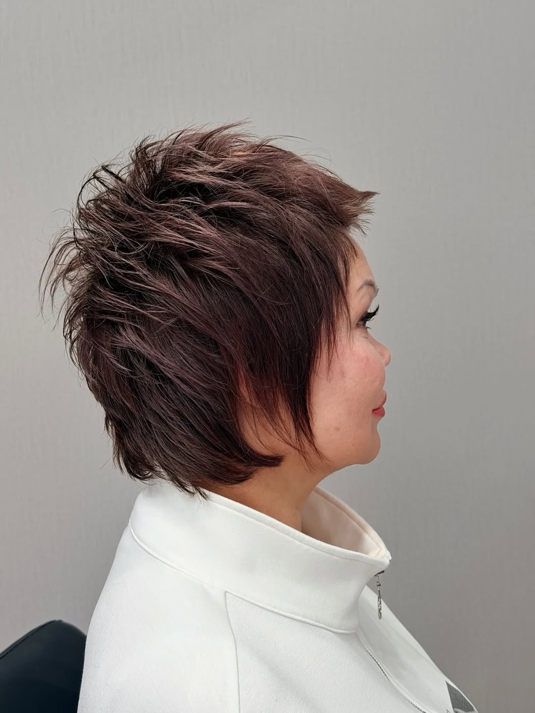 Textured Shaggy Pixie Cut With Auburn Tones
