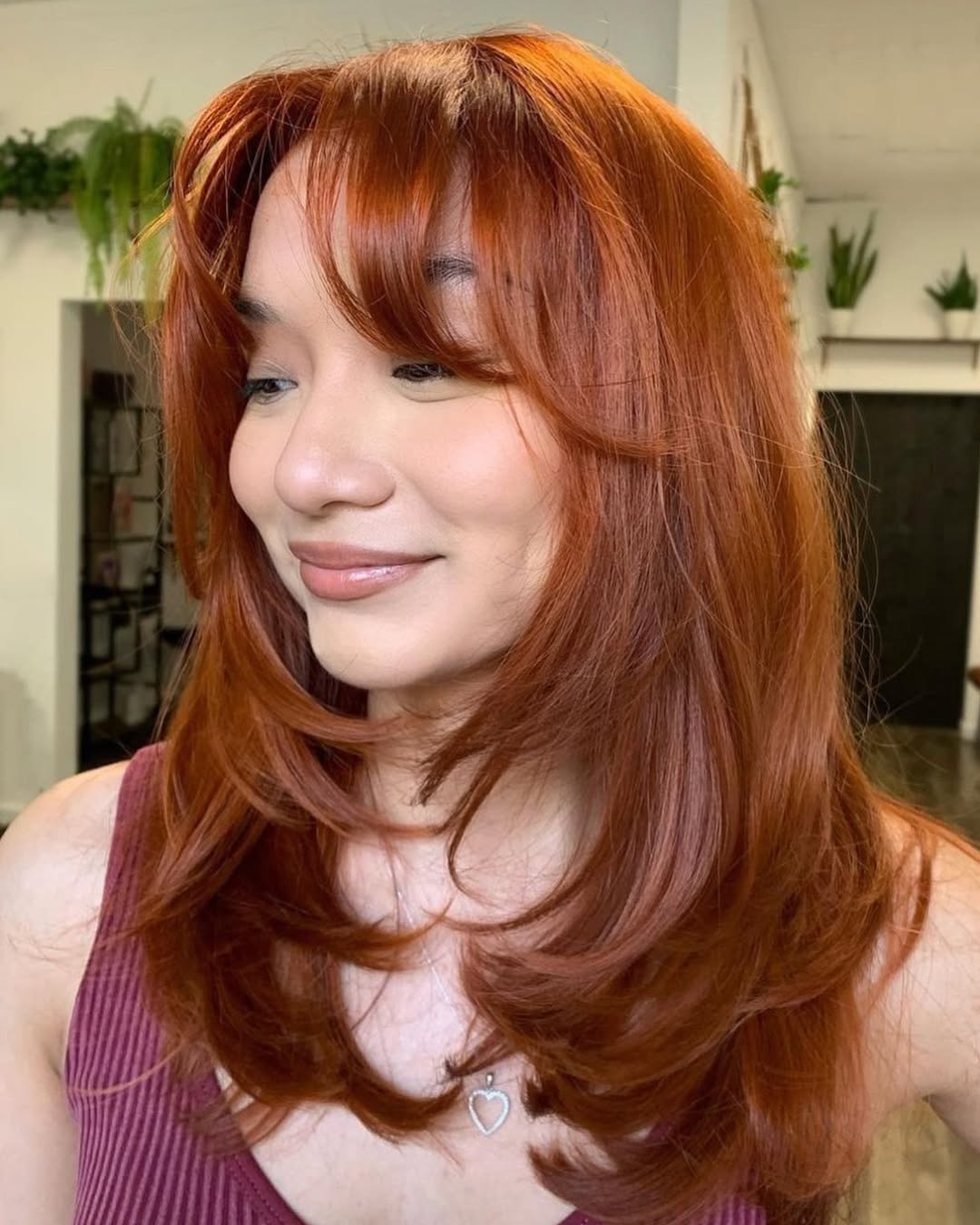Vibrant Copper Layers With Face Framing Fringe