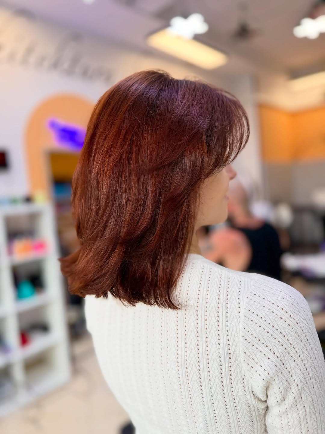 Vibrant Red Medium Layers With Wispy Bangs