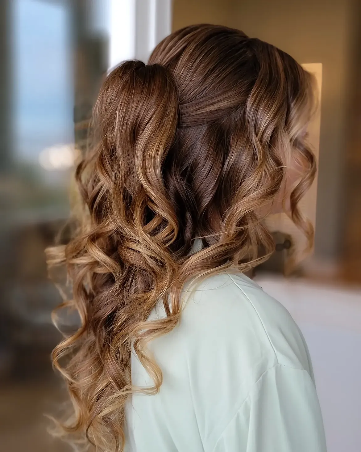 Voluminous Curls Half Up Half Down Hairstyle