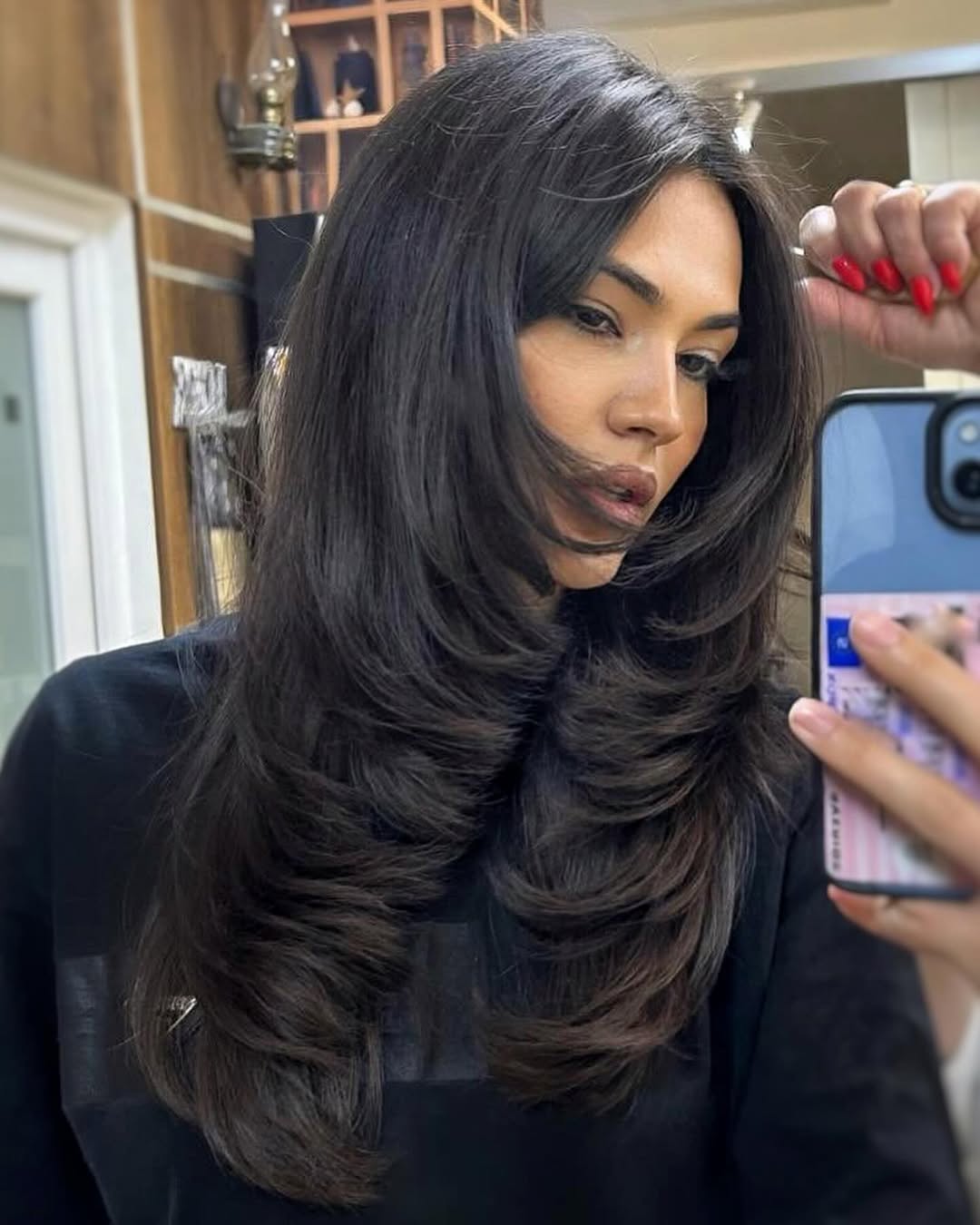Voluminous Dark Brown Layers With Face-Framing Bangs