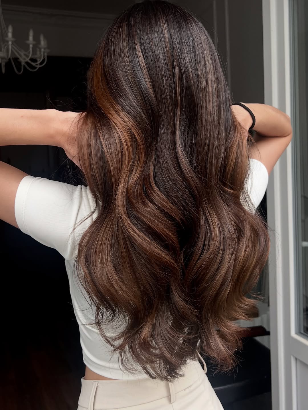 Warm Balayage Highlights on Dark Brown Waves