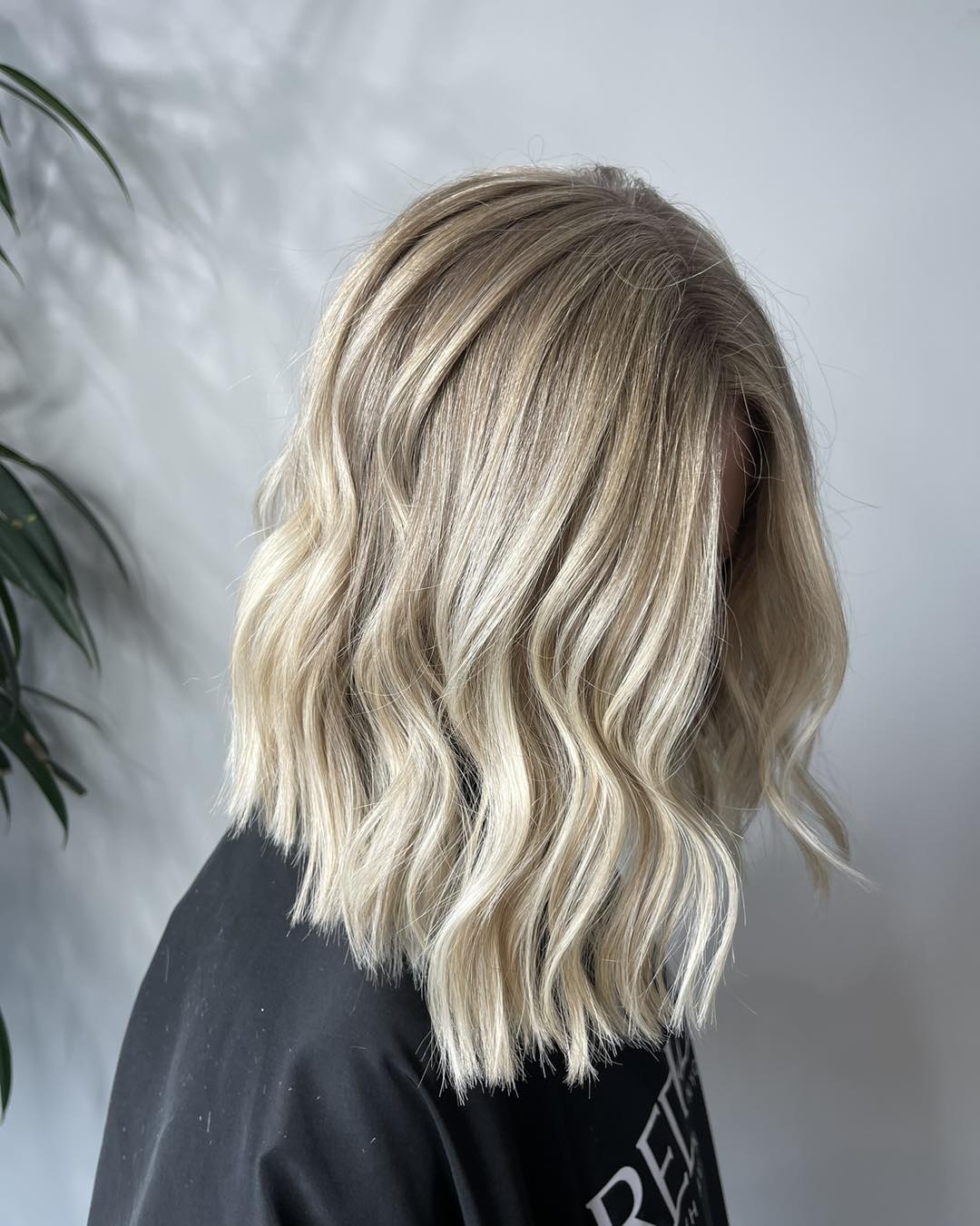 Wavy Platinum Blonde Lob with Subtle Dimensional Highlights