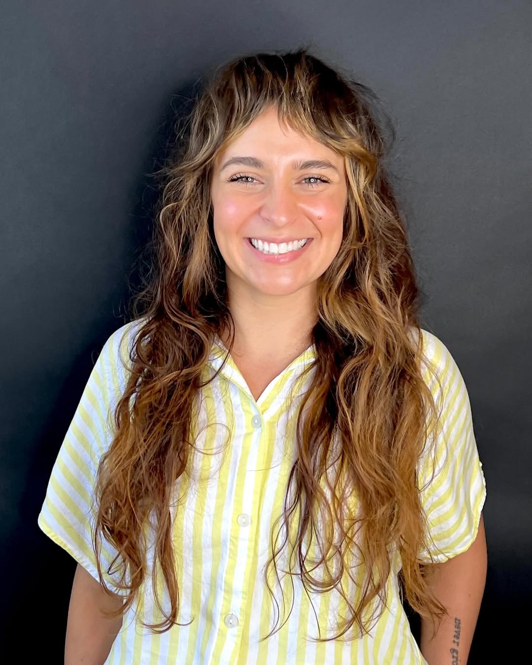 Wavy Shag With Wispy Bangs And Warm Balayage