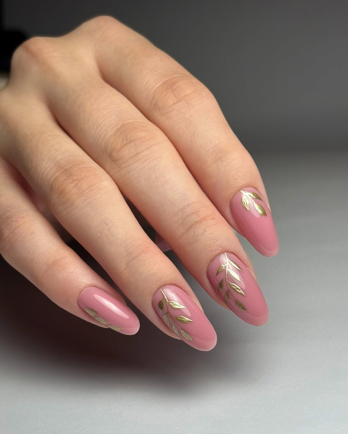 Blush Pink Almond Nails with Golden Leaf Accents