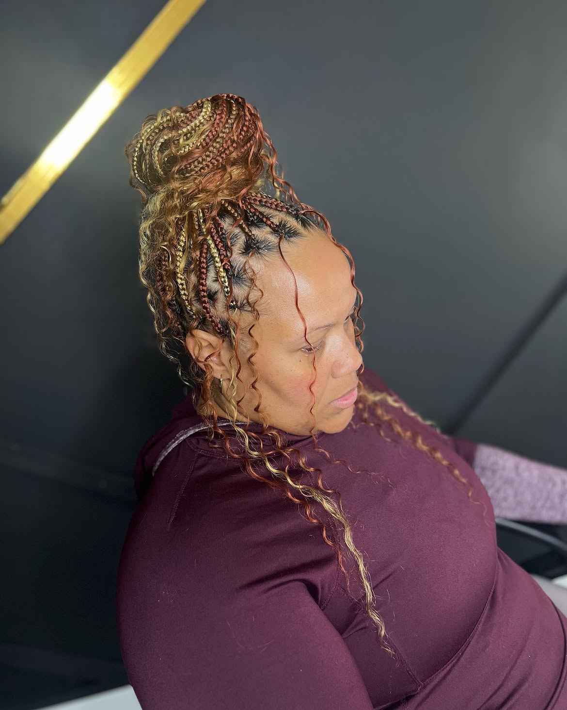 Braid Updo With Curly Tendrils And Warm Tones