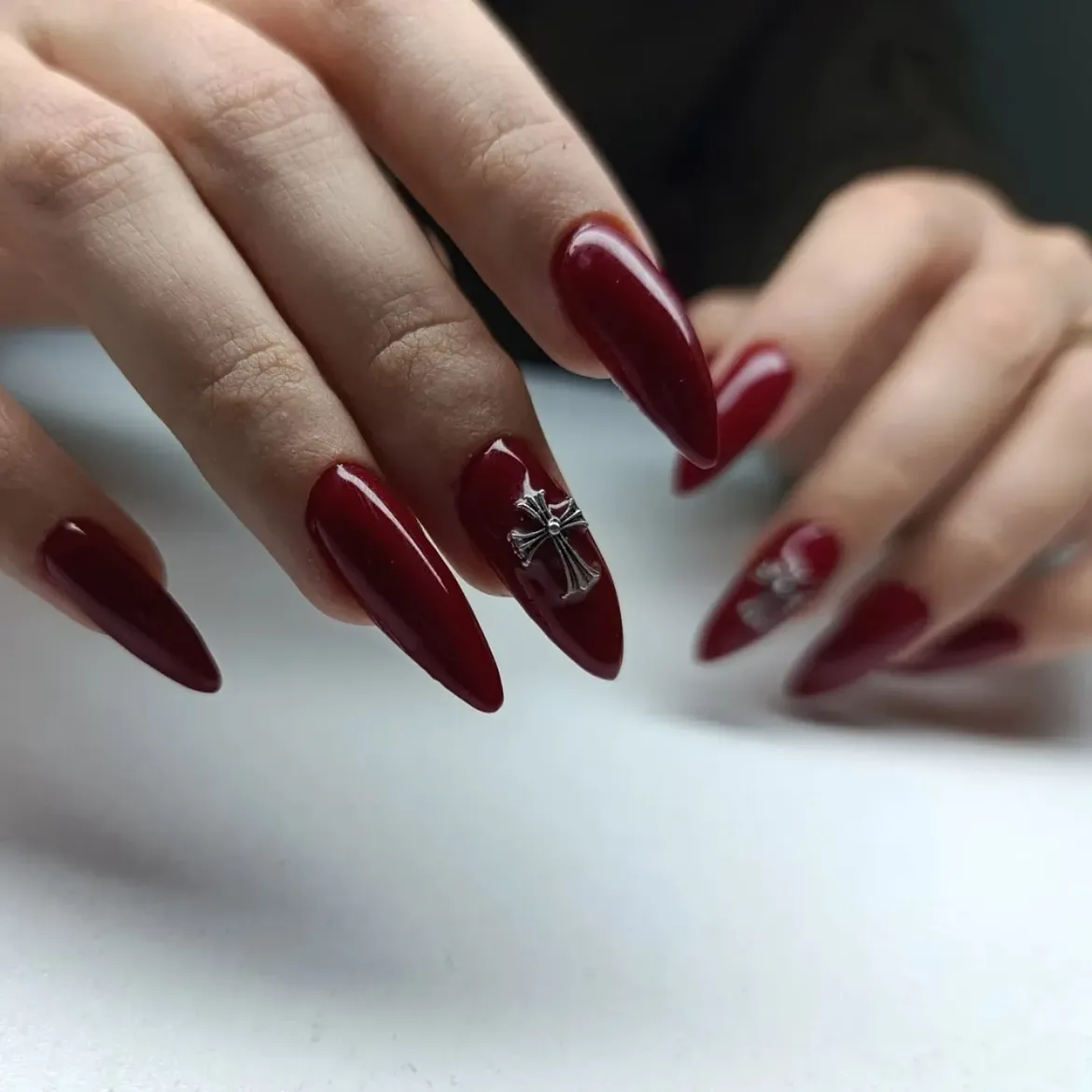 Chic Burgundy Stiletto Nails with Chrome Cross Charms