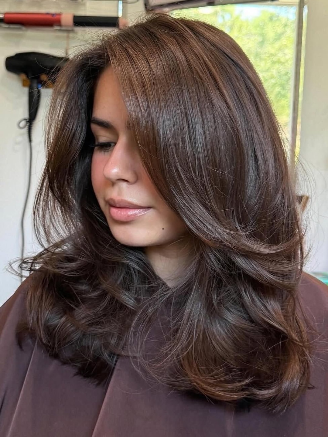 Chic Layered Brunette With Face-Framing Layers